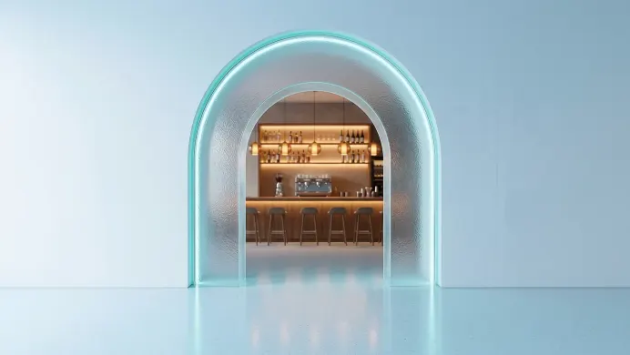 A frosted ice-glass arch opening onto a warm cocktail bar and café